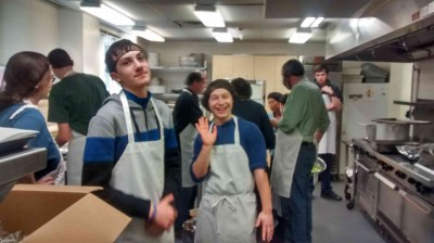 And later at the shelter kitchen where we actually finish everything.  You will note aprons and hair nets are the dress code here.